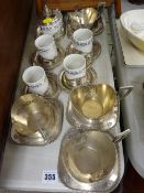 Weidmann porcelain and white metal group of four cups and saucers and sugar pot with cover and