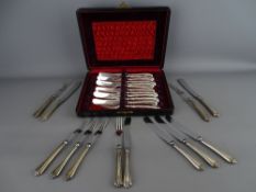 Cased set of six pastry knives and forks with hallmarked silver pistol grip handles and a further