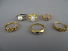 Two nine carat gold dress rings, 2.2 grms, an unmarked moonstone set ring, two eighteen carat gold