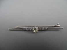 Art Deco style diamond set bar brooch, unmarked but believed tested white gold