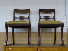 Three Regency mahogany sabre legged dining chairs with rope twist top detail