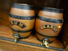 Pair of pottery liquor barrels for 'Rum' and 'Brandy', 32 cms high