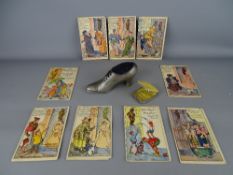 Nine 'Souvenir de Manneken Pis Bruxelles' humorous postcards, a vintage metal shoe pin cushion and a
