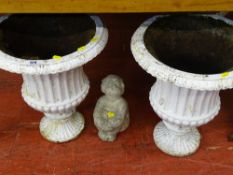 Pair of cast iron campana style planters and a small seated figurine garden ornament