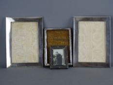 Four hallmarked silver photograph frames