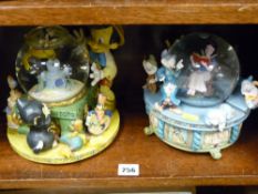 Two Disney snow globe type models