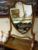 Shield shaped swing toilet mirror