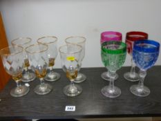 Harlequin set of four hock glasses, gilt rimmed set of six stemmed glasses