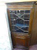 19th Century two piece oak floorstanding corner cupboard with astragal glazed top section and single