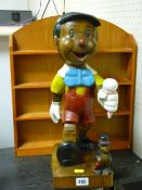 Excellent treen model of Pinocchio and a wall hanging shelving unit