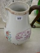 Circa 1820 Chinese export porcelain jug having numerous staple repairs and replacement handle