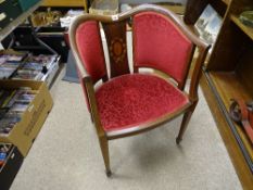 Red upholstered tub chair with central splat and floral inlay
