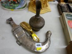 Eastern type sheathed dagger with white metal mounts marked 'Owen Jones, Mauritius', an Eastern
