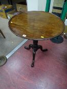 Circular tilt and tray top tripod table