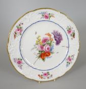 A FINELY DECORATED NANTGARW PORCELAIN PLATE with lobed rim and having a moulded border with C-