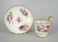 A FINE NANTGARW PORCELAIN CUP & SAUCER footed and with inverted heart shaped handle, gilt dentil rim