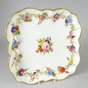 A SWANSEA PORCELAIN SQUARE DISH of rounded and fluted form with dentil gilded rim, decorated with