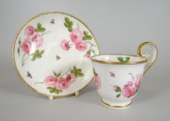 A FINE NANTGARW PORCELAIN CUP & SAUCER footed and with inverted heart shaped handle, gilt dentil rim