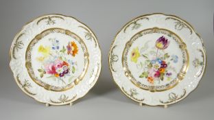 A PAIR OF SWANSEA PORCELAIN DESSERT PLATES with lobed rim and having a moulded border with C-