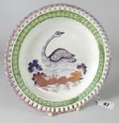 A DILLWYN & CO SWANSEA POTTERY RIBBON PLATE having a basket-weave border painted green and decorated