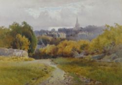 ARTHUR TUCKER (1864-1929) watercolour - view of Tenby town from a distance with sea beyond the