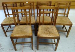 SIX RUSH SEATED BRYNMAWR OAK CHAIRS having lattice backs