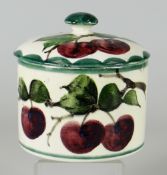 A LLANELLY POTTERY PLUM DECORATED COVERED JAR having a mushroom knop, marked Llanelly in black