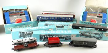 Quantity of boxed Marklin rolling stock to include two transformers, local passenger coach,