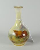 A Royal Worcester porcelain miniature bottle vase painted with two highland cattle in a landscape by