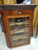 A nineteenth century mahogany single-glazed door hanging corner cabinet, 80cms wide Condition