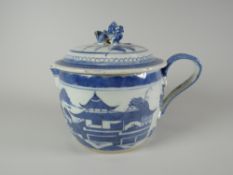 A Chinese blue & white export lidded jug, the lid with Dog of Fo finial and decorated with village