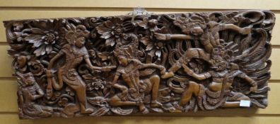 Mid-twentieth century single-block Indonesian deep carved wood panel of dancing figures, 18 x