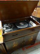 A Garrard belt-drive record and cassette player in a mahogany effect cabinet Condition reports