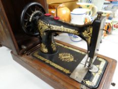 Vintage Singer sewing machine with original handled hood Condition reports provided on request by