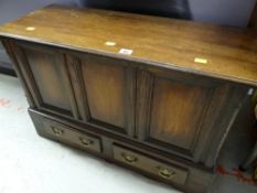 A small antique-reproduction coffer-bach having a hinged lid with two drawers in the base, 53cms h x