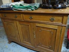 A light oak sideboard base with two drawers and three cupboards, 102cms h x 153cms l x 53cms d