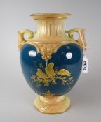 A Royal Worcester twin-handled blush vase on circular spreading foot and with aquamarine body