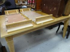 A modern lightwood extending dining table, 107cms wide x 162cms long Condition reports provided on