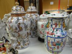 A pair of large Oriental-style lidded vases, a modern Famille Rose vase and a Bavarian lidded vase