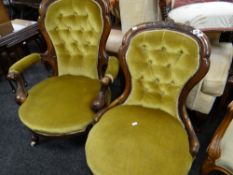 A pair of Victorian walnut spoon-back armchairs with buttoned backs and having foliate carved