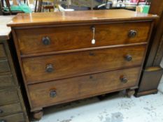 A Victorian mahogany three-drawer chest with turned handles and locks, 109cms wide x 89cms high