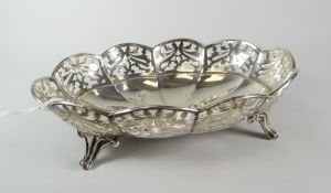 Solid silver pierced bon-bon dish raised on four scroll-type feet, London hallmarked, makers initals