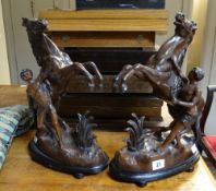 A pair of metallic Marly-type horses and warrior sculptures Condition reports provided on request by