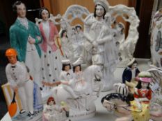 A collection of Staffordshire figures including three bough groups, a wedding couple ETC Condition