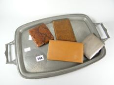 A machine turned silver cigarette case, a 'genuine snakeskin' cigarette case, two Orlik of Old