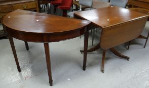 A mahogany drop-flap table on spider supports with brass claw feet and castors (damage) 82cms