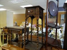 A folding mahogany cake stand, two carved tables, a carved planter stand Condition reports