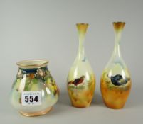 A Royal Worcester footed vase of lobed form and with narrow neck decorated with yellow and pink