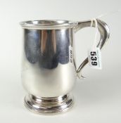 A silver footed mug of plain form with inscriptions, 9.8ozs Condition reports provided on request by