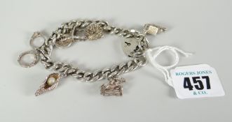 Silver charm bracelet with assorted charms Condition reports provided on request by email for this
